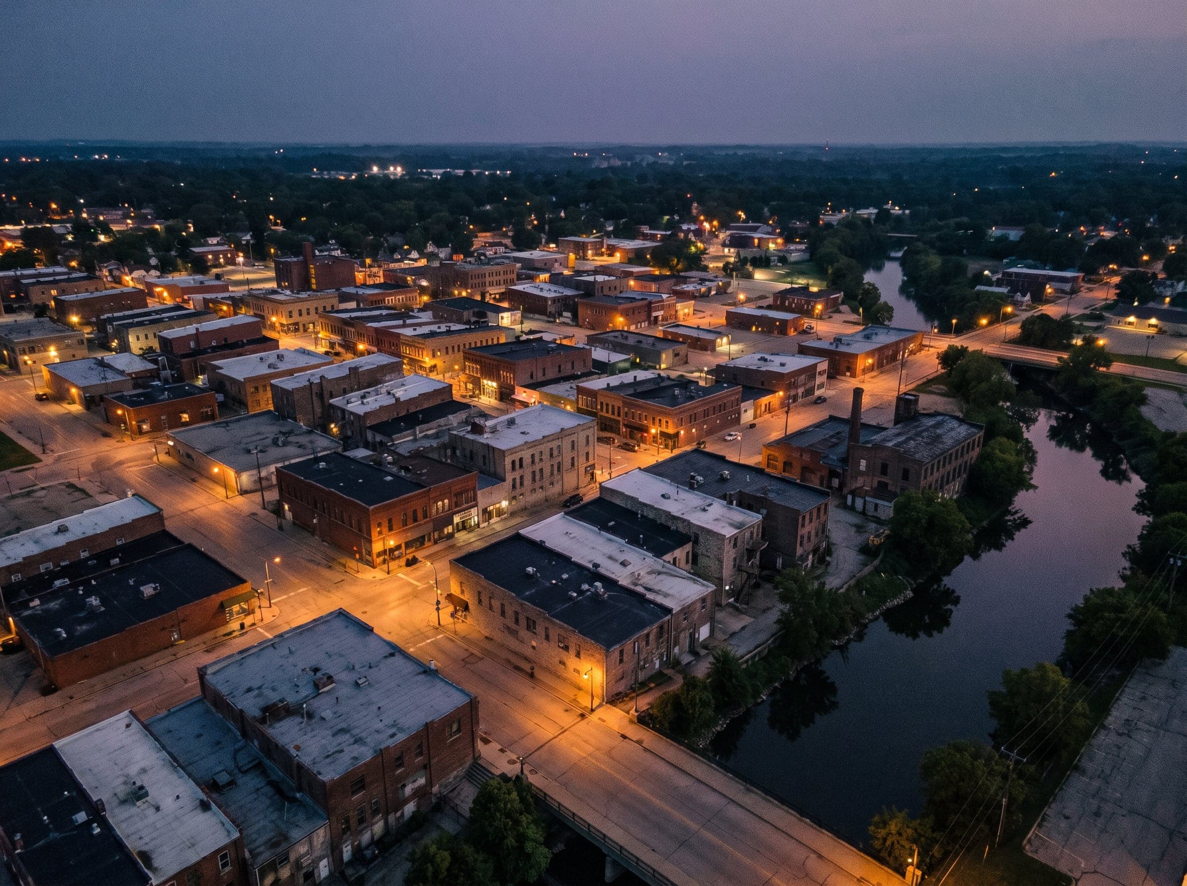 Aerial of a Wisconsin commercial district at dusk — the kind of property a title policy covers